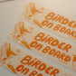 Multiple 'Birder on Board' bumper stickers with a bird illustration on a light background